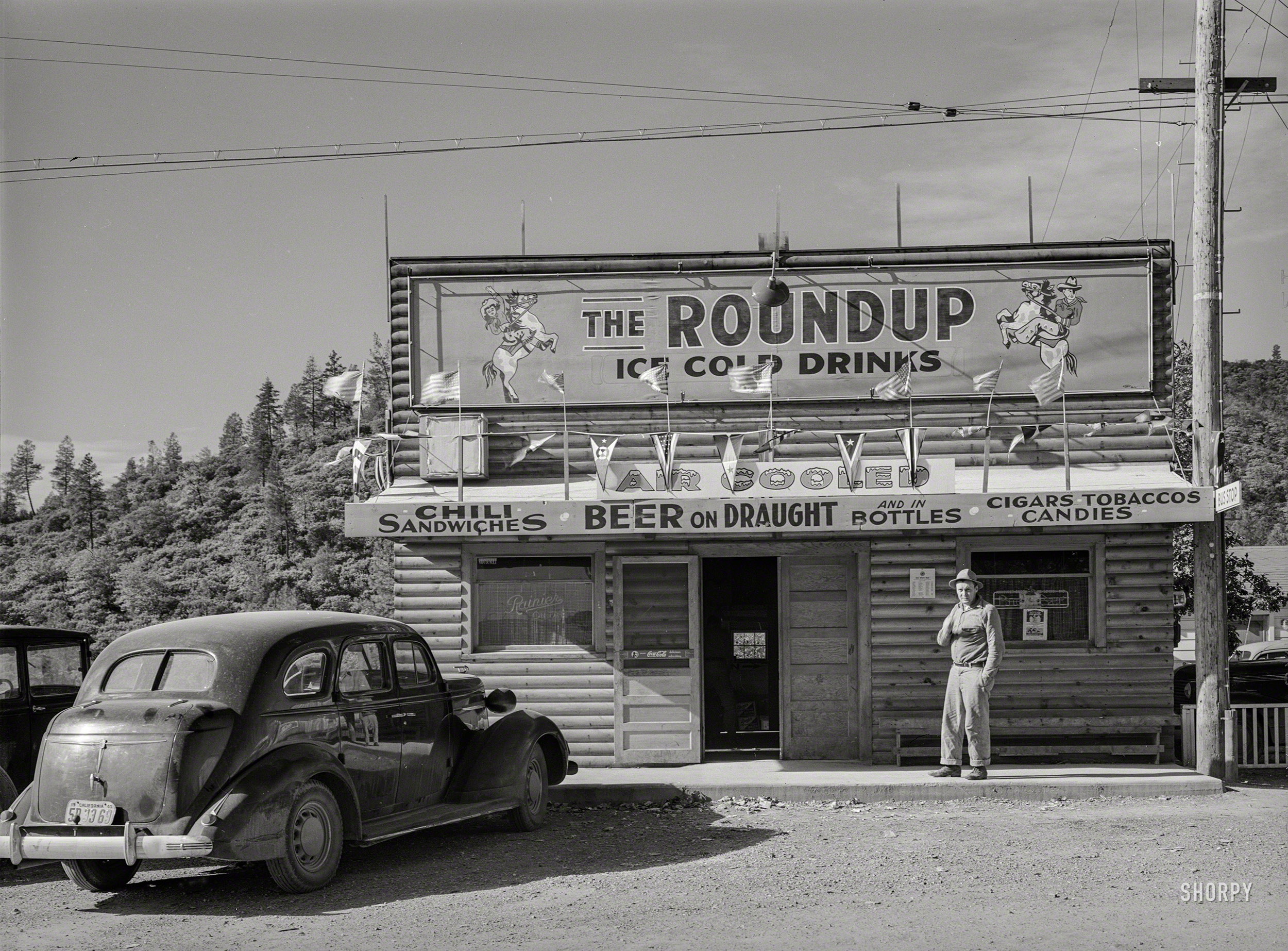 November 1940. "Restaurant and beer hall in Summit City, California, boom town near Shasta Dam." Medium format negative by Russell Lee. View full size.