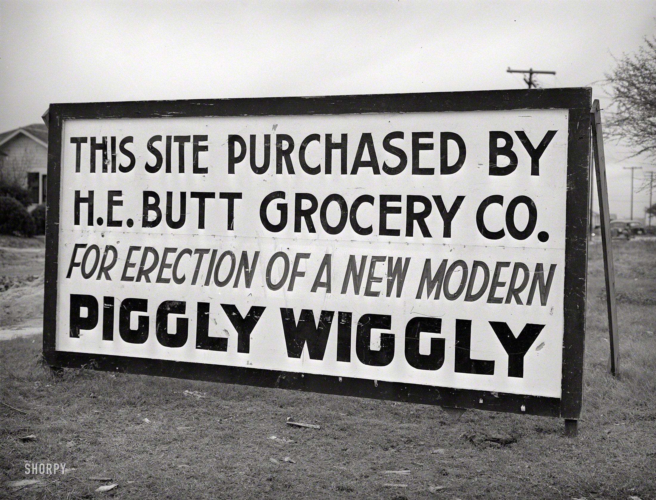 December 1940. Corpus Christi, Texas. "Sign announcing new grocery store in community springing up about five miles from the naval air base under construction." Medium format negative by Russell Lee. View full size.