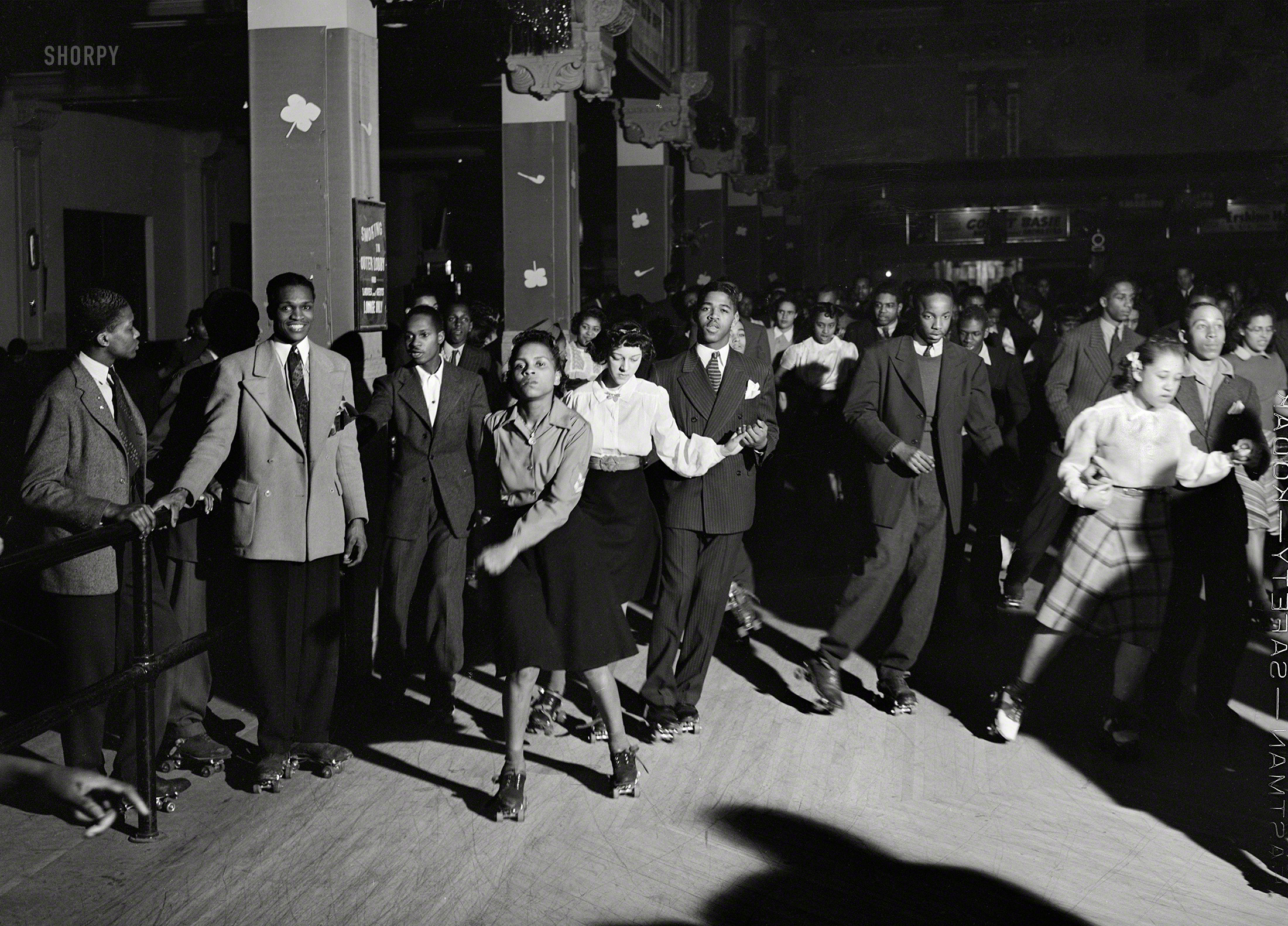 April 1941. "Rollerskating on Saturday night. Chicago, Illinois." Medium format negative by Russell Lee for the Farm Security Administration. View full size.