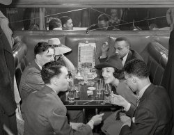 April 1941. "Booth in Negro tavern on southside of Chicago." Medium format negative by Russell Lee for the Farm Security Administration. View full size.