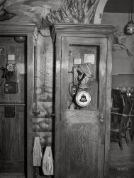 April 1941. "South Side Chicago. Telephone booth in Negro tavern." The Bronzeville watering hole known as Tony's Tavern. Acetate negative by Russell Lee. View full size.