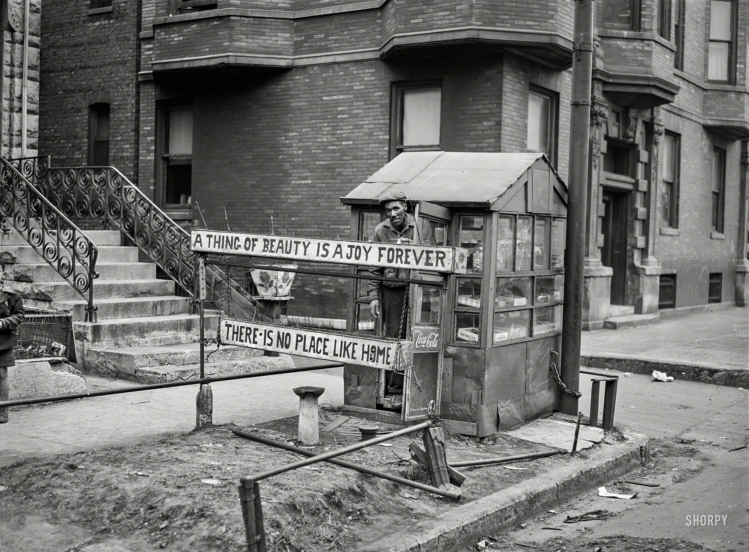 April 1941. "Candy stand run by Negro, Southside Chicago." Medium format negative by Russell Lee for the Farm Security Administration. View full size.