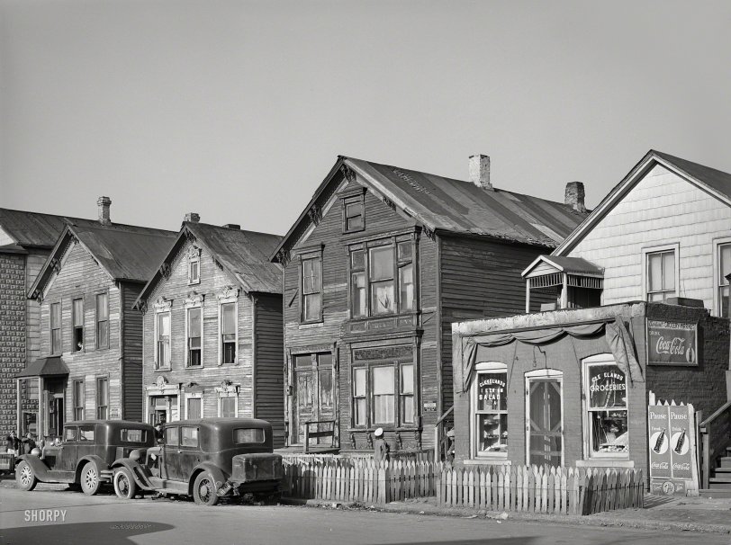 April 1941. "Houses and grocery store on Federal Street in the Negro section of Chicago." Medium format acetate negative by Russell Lee. View full size.
