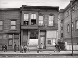 April 1941. "House and children in Negro section (South Side) of Chicago, Illinois." Medium format acetate negative by Russell Lee for the Farm Security Administration. View full size.