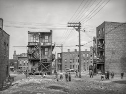 April 1941. "Chicago, Illinois. Housing available to Negroes on the South Side. Children playing in vacant lot." Photo by Russell Lee for the Farm Security Administration. View full size.
