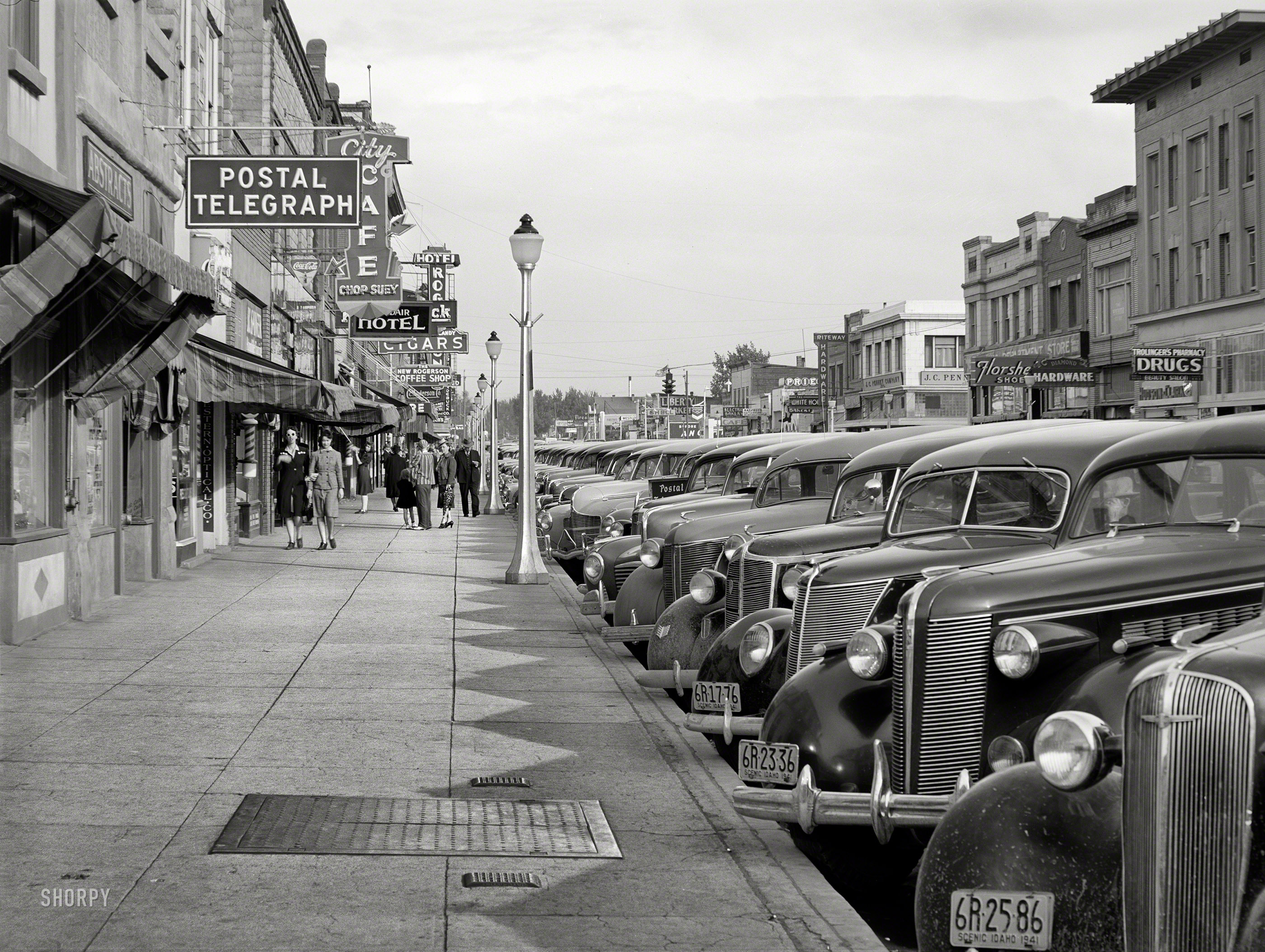May 1941. "Main street of Twin Falls, Idaho. Among industries in this town are a sugar beet factory, cannery and it is a shipping center for potatoes and onions." Photo by Russell Lee for the Farm Security Administration. View full size.