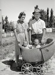 May 1941. "Farm worker with his wife and their twin babies at the FSA  migratory labor camp mobile unit. Wilder, Idaho." Medium format acetate negative by Russell Lee for the Farm Security Administration. View full size.