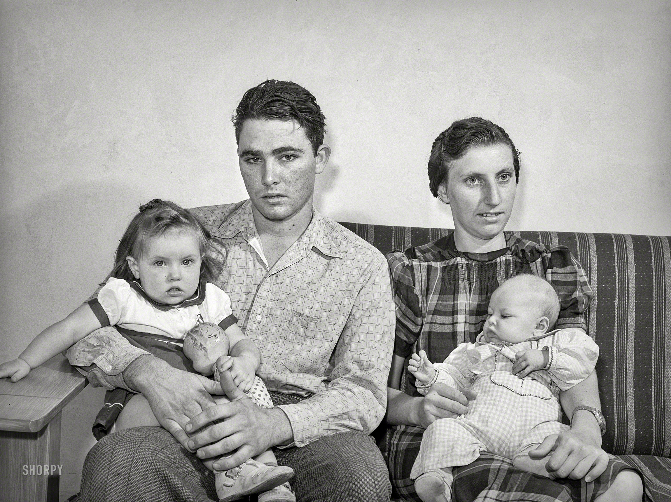 May 1941. San Diego. "Family living at Kearney Mesa defense housing project. This man came to California from Oklahoma 10 years ago. He has been an agricultural worker living in various FSA camps. Now employed as a painter at Consolidated Aircraft." Acetate negative by Russell Lee for the Farm Security Administration. View full size.