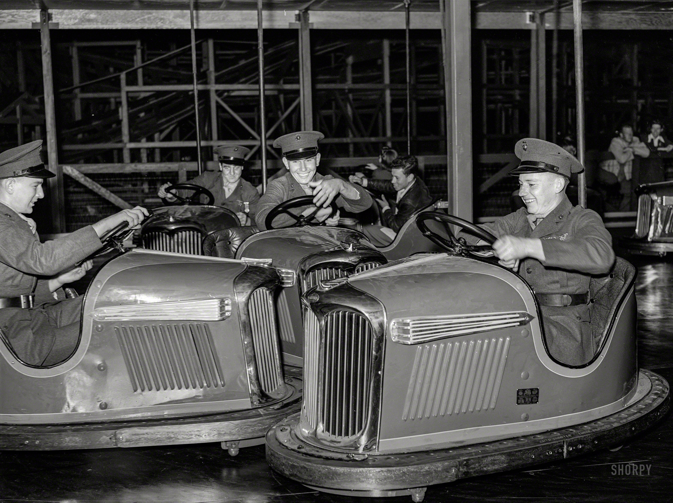 May 1941. "Marines riding the electric automobiles at Mission Beach amusement center, San Diego." Medium format negative by Russell Lee. View full size.