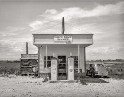 June 1941. "Filling station and store across the street from the FSA labor camp. Caldwell, Idaho." Acetate negative by Russell Lee for the Farm Security Administration. View full size.