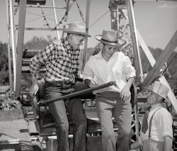 July 1941. "Farm boys getting on the ferris wheel, one of the attractions at the Fourth of July celebration at Vale, Oregon." Medium format acetate negative by Russell Lee for the Farm Security Administration. View full size.