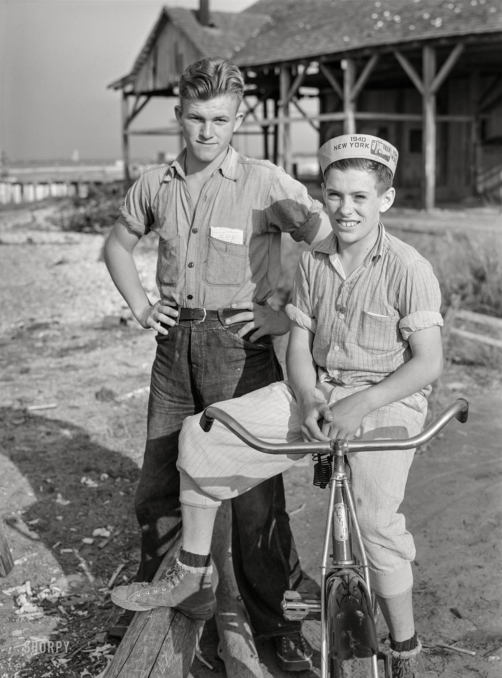 May 1940. "Two boys, sons of fishermen. Deal Island, Maryland." Medium format negative by Jack Delano for the Farm Security Administration. View full size.