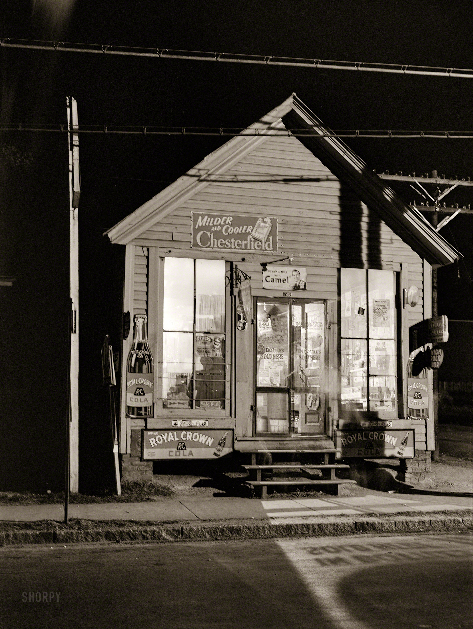 May 1940. "Corner store at 11 p.m. Durham, North Carolina." Medium format negative by Jack Delano for the Farm Security Administration. View full size.