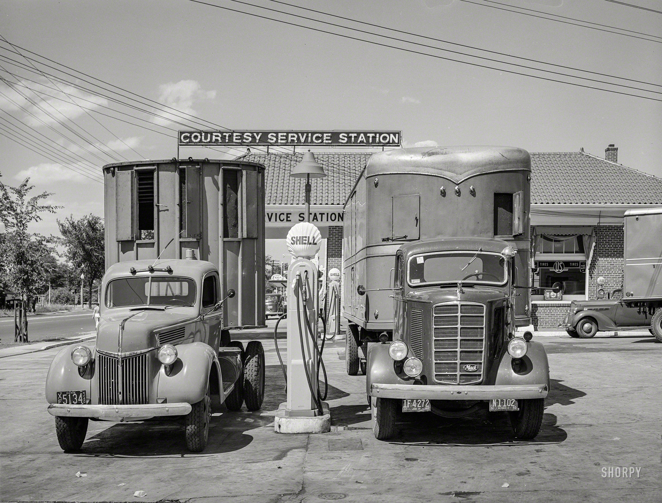 June 1940. "Trucks in service station on Bladensburg Road, Washington, D.C., U.S. Route 1." Medium format negative by Jack Delano. View full size.
