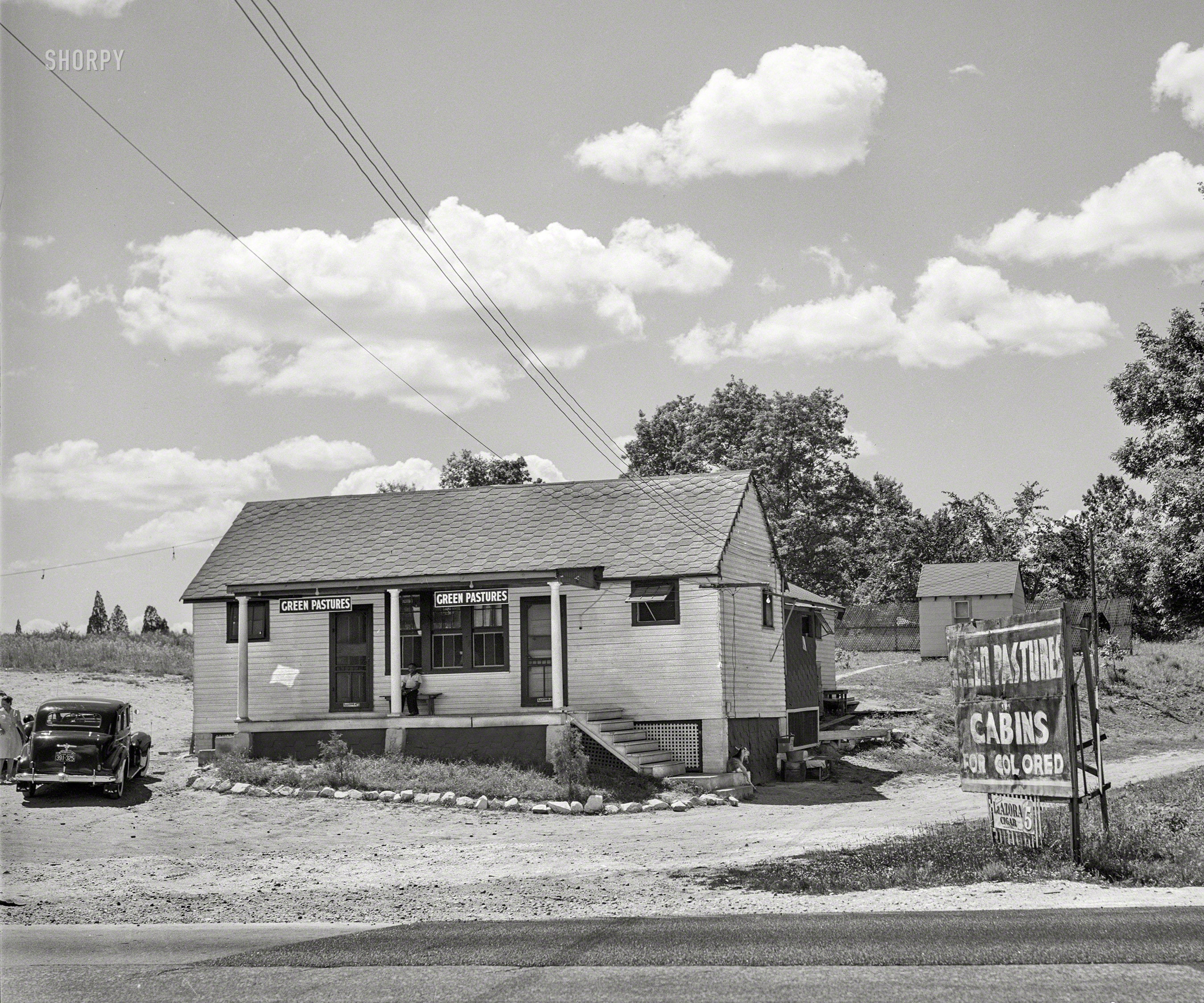 June 1940. "Colored tourist cabins along U.S. Highway No. 1, between Washington and Baltimore. Near Waterloo, Maryland." Medium format negative by Jack Delano for the Farm Security Administration. View full size.