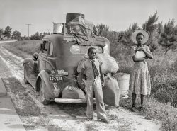 July 1940. "Near Shawboro, North Carolina. Group of Florida migrants on their way to Cranberry [i.e., Cranbury], New Jersey, to pick potatoes." Some of the folks last seen here -- 12 years ago! Photo by Jack Delano for the Farm Security Administration. View full size.