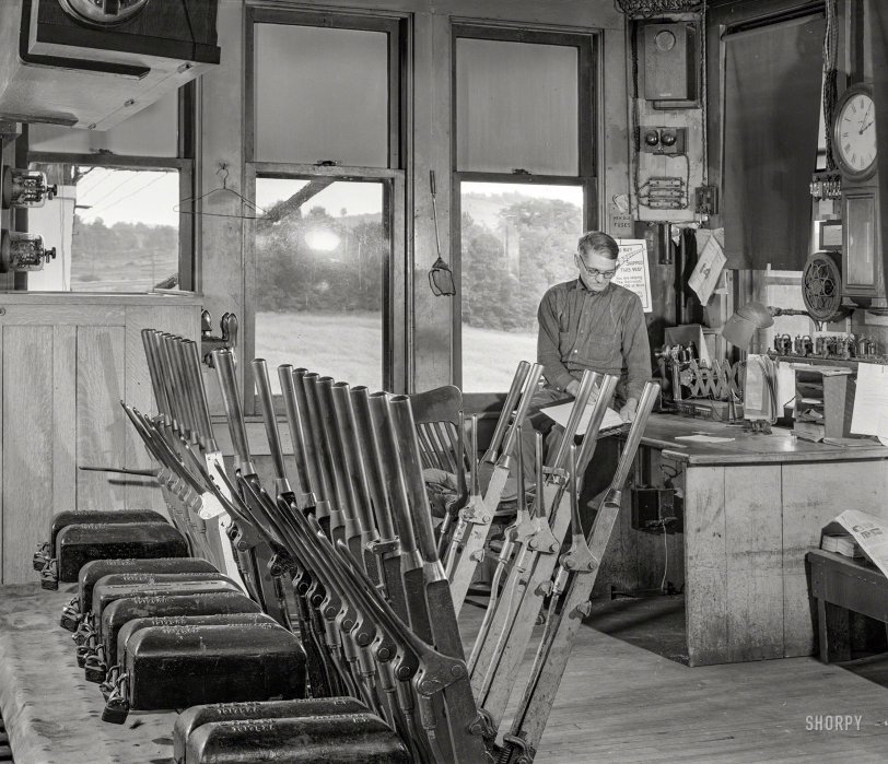 September 1940. "Mr. T.J. Long, president of the Tri-County Farmers Co-op Market in Clearfield County, Pennsylvania, at his work in a railroad tower near Du Bois." Medium format acetate negative by Jack Delano. View full size.
