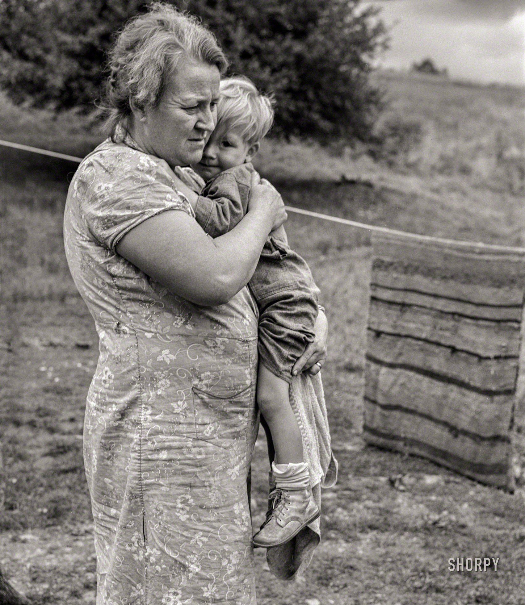 September 1940. "Farm woman holding one of her children in submarginal area of Rumsey Hill, near Erin, New York." Happy Mother's Day from Shorpy! Medium format negative by Jack Delano for the Farm Security Administration. View full size.