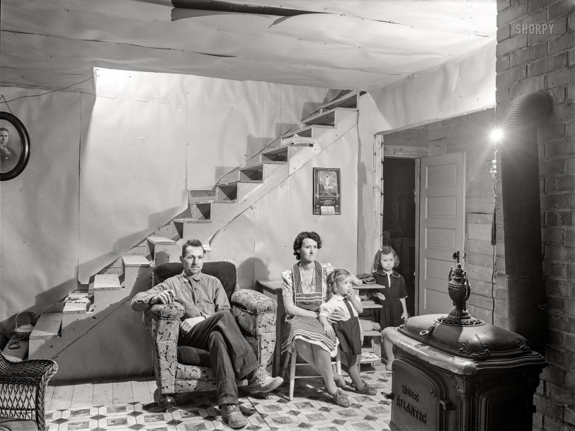 October 1940. "Mr. and Mrs. Lindore Labbe and children in their newly-built home. Mr. Labbe, FSA client, runs a small seed foundation unit in Wallagrass, Maine." Medium format acetate negative by Jack Delano for the Farm Security Administration. View full size.
