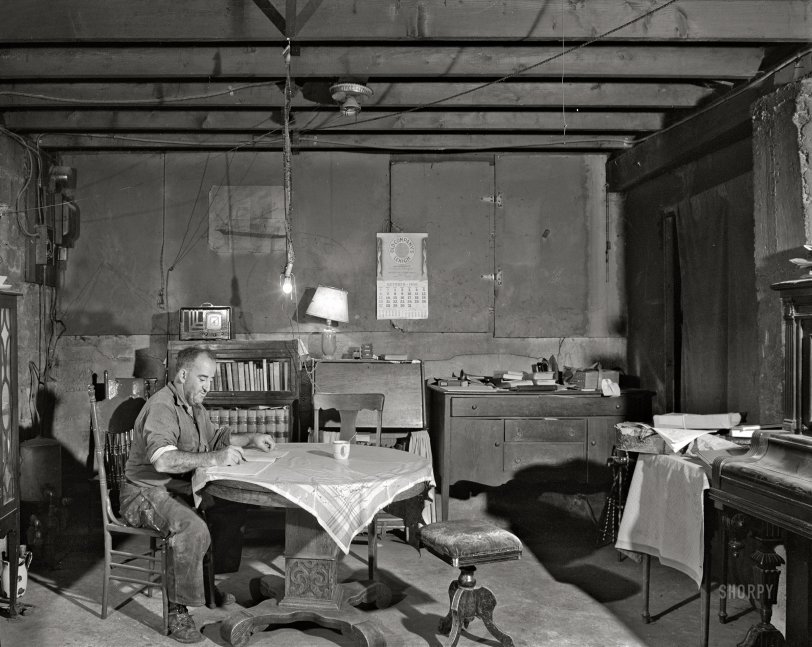 November 1940. "Mr. George Howe lives in the cellar of what was formerly his house. The top part was completely destroyed in the hurricane. He runs a small farm near Canterbury, Connecticut." Photo by Jack Delano for the Farm Security Administration. View full size.

