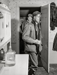 November 1940. Ledyard, Connecticut. "Two of the Crouch family boys coming home for the Thanksgiving Day dinner after a morning of hunting in the woods." Medium format acetate negative by Jack Delano for the Farm Security Administration. View full size.