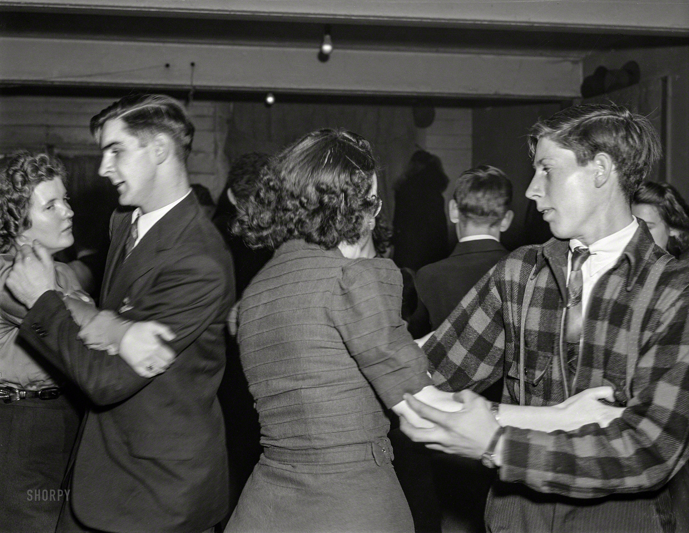 December 1940. "At a Saturday night square dance in Clayville, Rhode Island." Medium format acetate negative by Jack Delano. View full size.