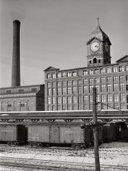 January 1941. "Railroad cars and factory buildings in Lawrence, Massachusetts." Medium format acetate negative by Jack Delano for the Farm Security Administration. View full size.