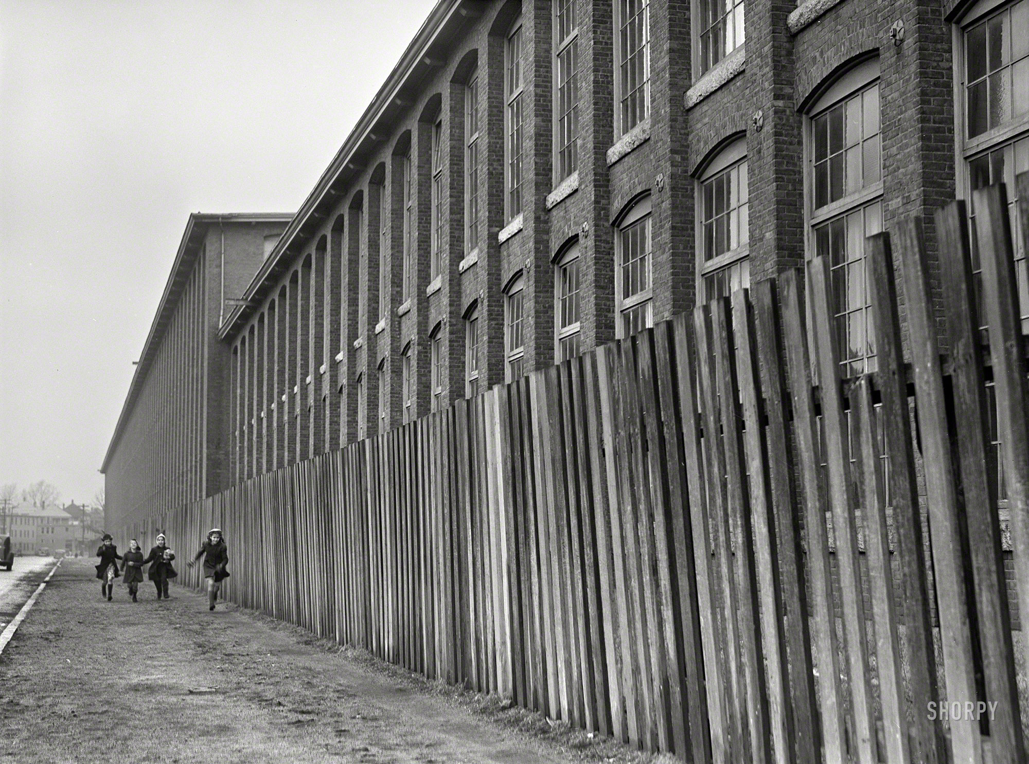January 1941. "Outside a large textile mill in New Bedford, Massachusetts." Medium format acetate negative by Jack Delano. View full size.