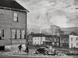 &nbsp; &nbsp; &nbsp; &nbsp; "Those icicles have been known to kill people!"
January 1941. "Houses and Pittsburgh Crucible Steel Company in Midland, Pennsylvania." Medium format negative by Jack Delano. View full size.
