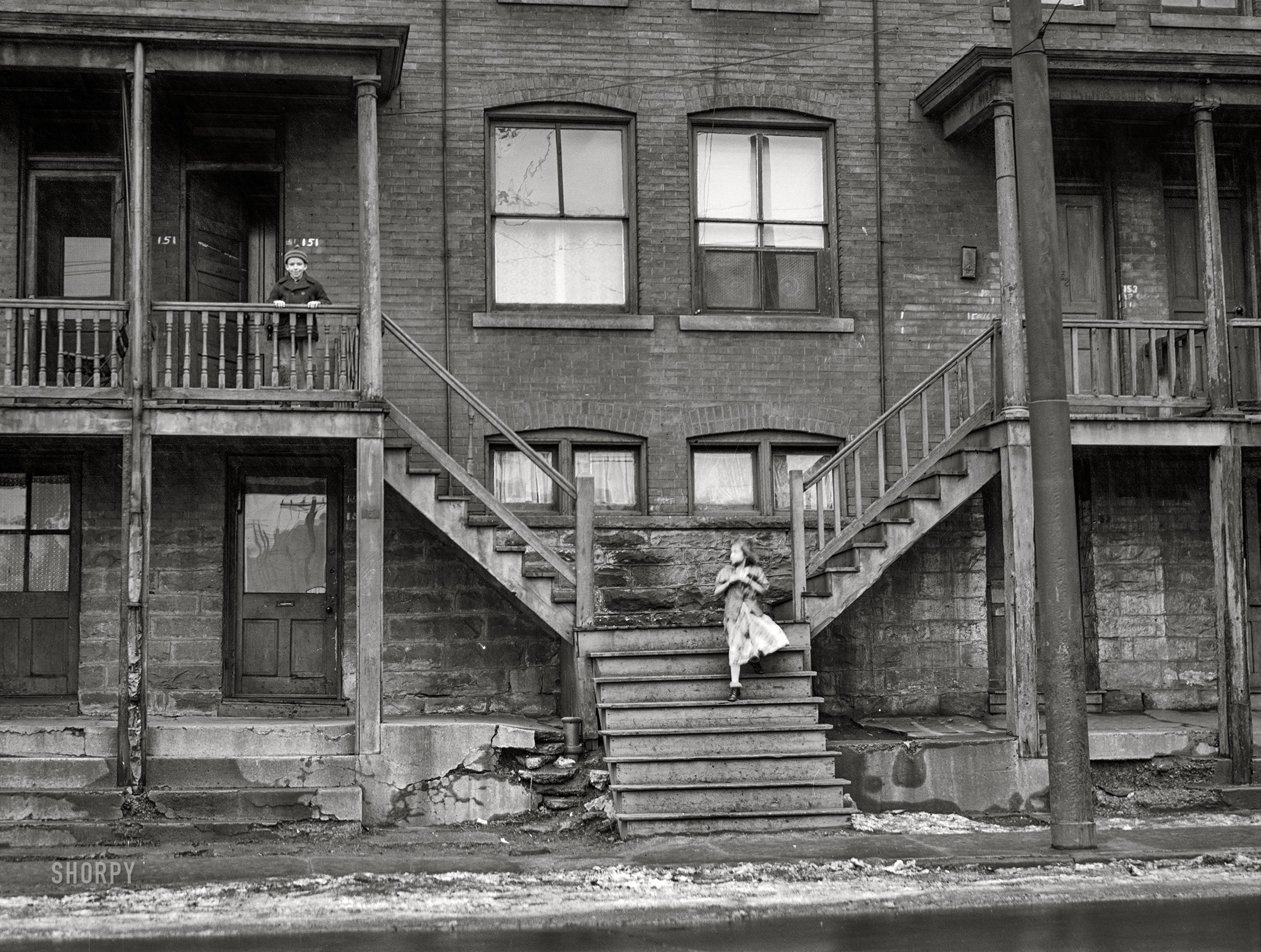 January 1941. "In a slum area of Pittsburgh, Pennsylvania." Medium format acetate negative by Jack Delano for the Farm Security Administration. View full size.