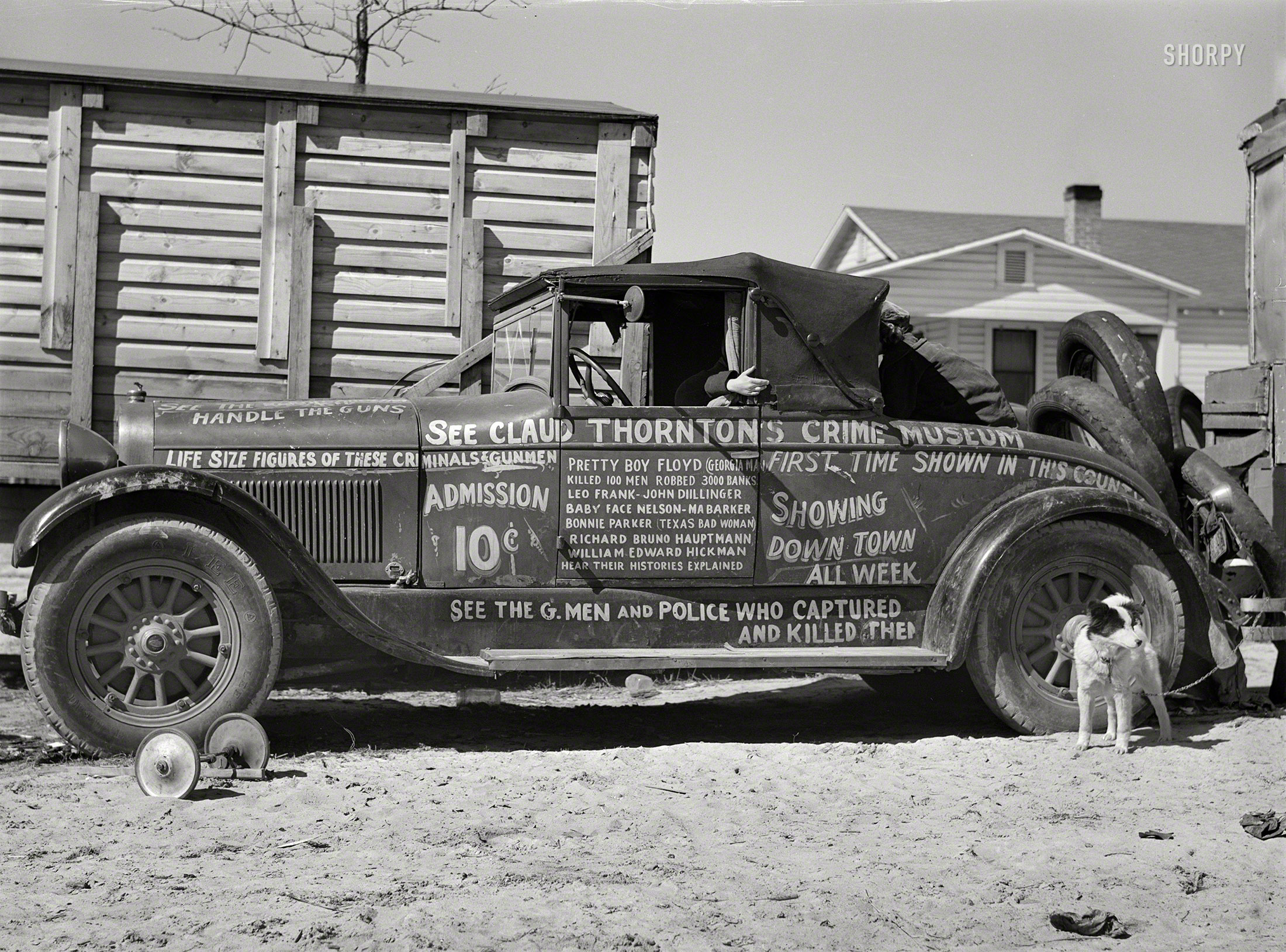 March 1941. "Car advertising 'crime museum' traveling sideshow near Fort Bragg, North Carolina." Medium format negative by Jack Delano. View full size.