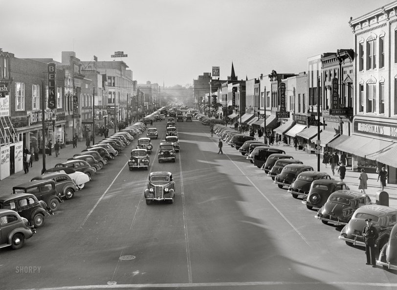 March 1941. "Traffic on the main street of Fayetteville, North Carolina, at about five o'clock, when the workers start coming out of Fort Bragg." Photo by Jack Delano. View full size.

