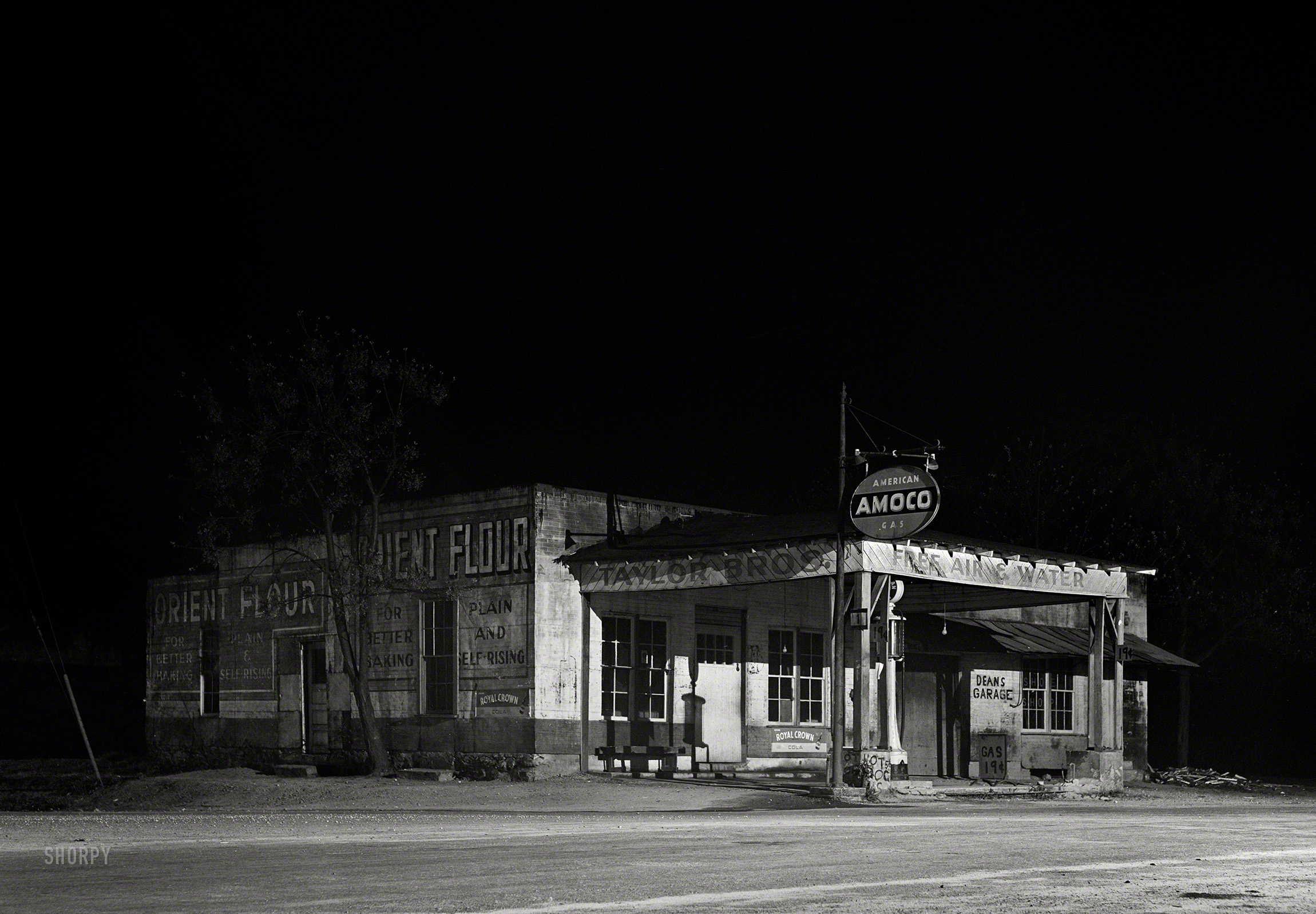 April 1941. "Gas station in Franklin, nine o'clock in the evening. Heard County, Georgia." Medium format acetate negative by Jack Delano. View full size.