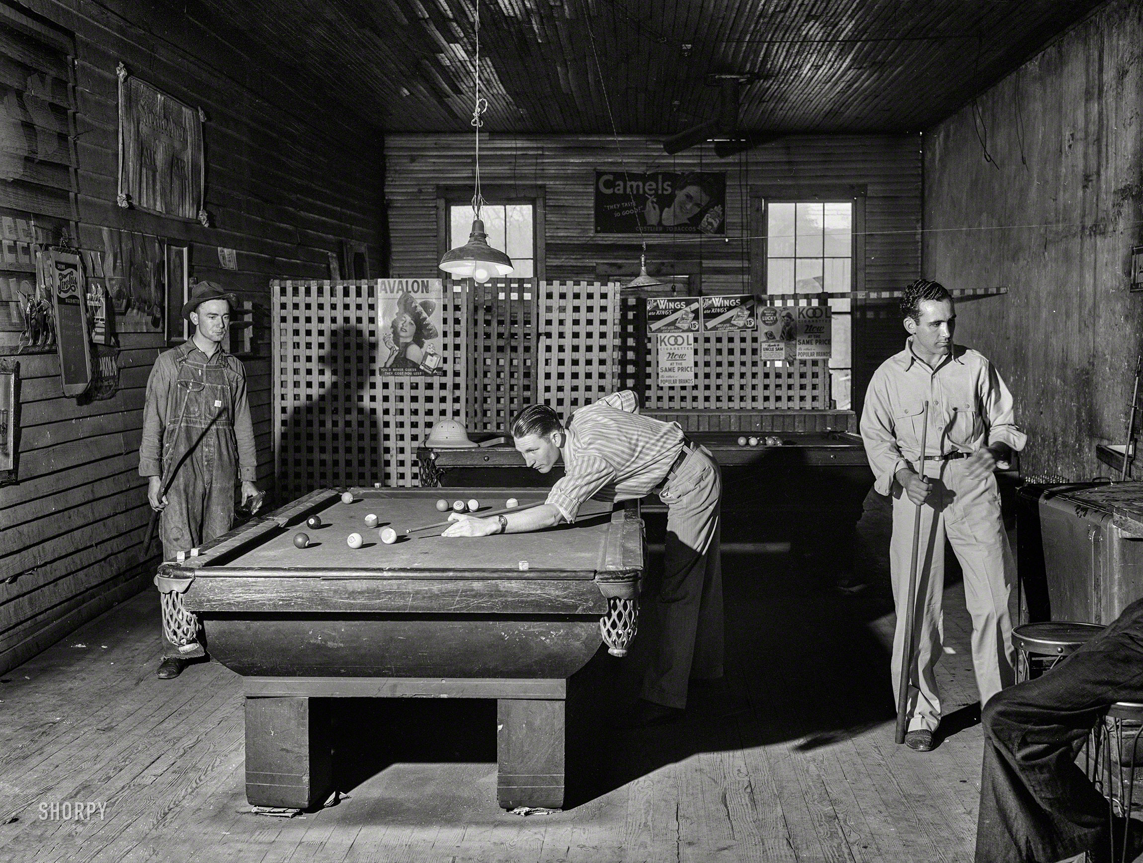 April 1941. "Franklin, Heard County, Georgia. A game of pool in the general store." Medium format acetate negative by Jack Delano. View full size.