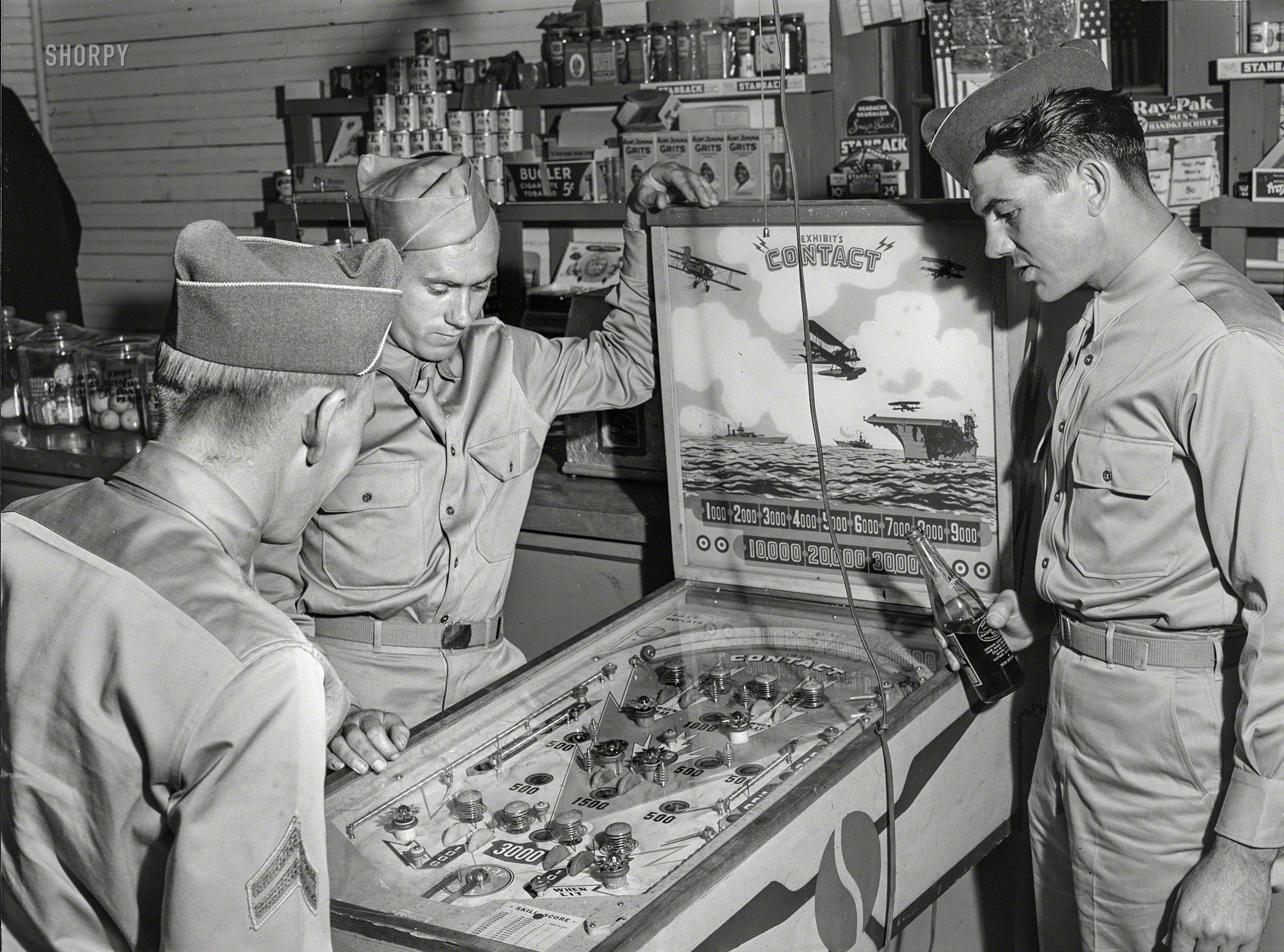 May 1941. "Soldiers from Fort Benning in a country store near Phenix City, Alabama." Medium format negative by Jack Delano. View full size.