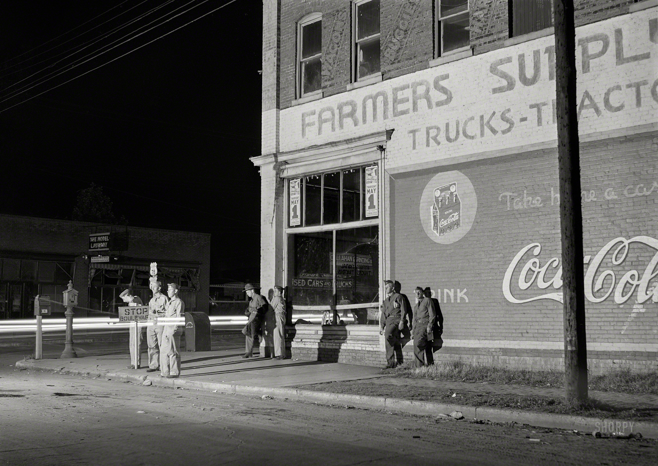 May 1941. "Soldiers from a nearby Army camp waiting for the bus in Anniston, Alabama." Medium format negative by Jack Delano. View full size.
