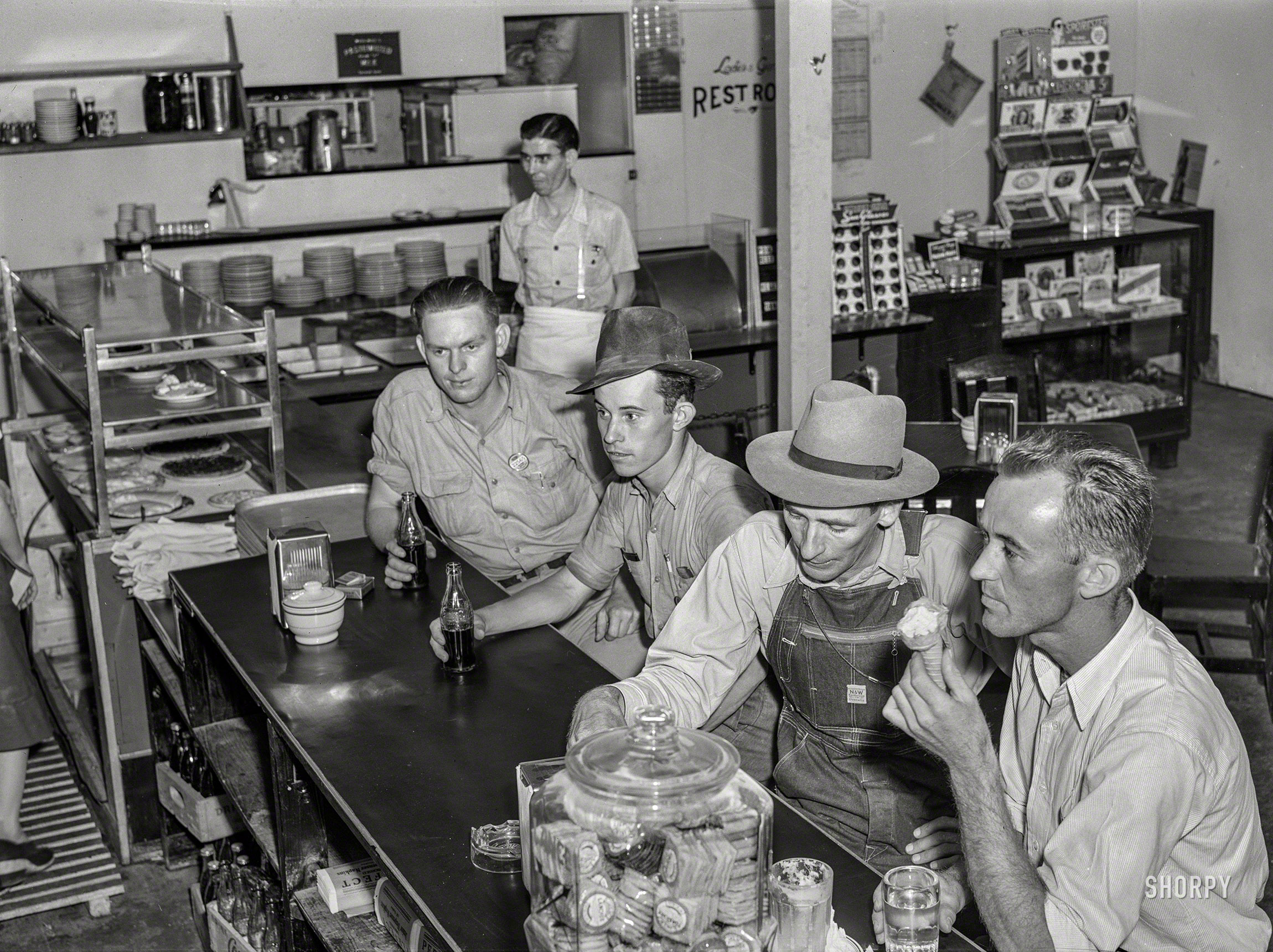 May 1941. "Workmen from the nearby Dupont powder plant in a cafe in Childersburg, Alabama." Acetate negative by Jack Delano. View full size.