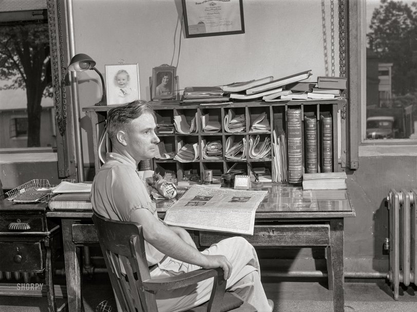 June 1941. "Mr. Lloyd Lewis, Greene County ordinary, in his office in Greensboro, Georgia." Medium format negative by Jack Delano for the Resettlement Administration. View full size.
