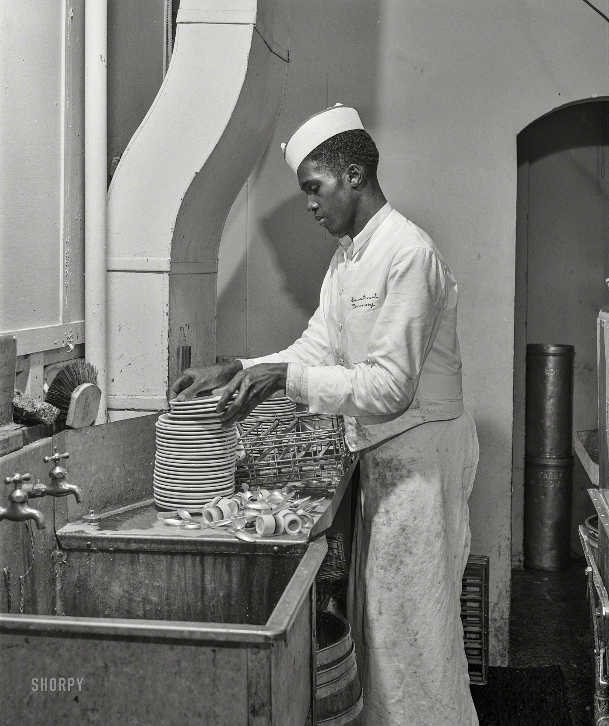 July 1941. "Negro dishwasher. Investment Pharmacy, Washington, D.C." Acetate negative by Jack Delano for the Farm Security Administration. View full size.