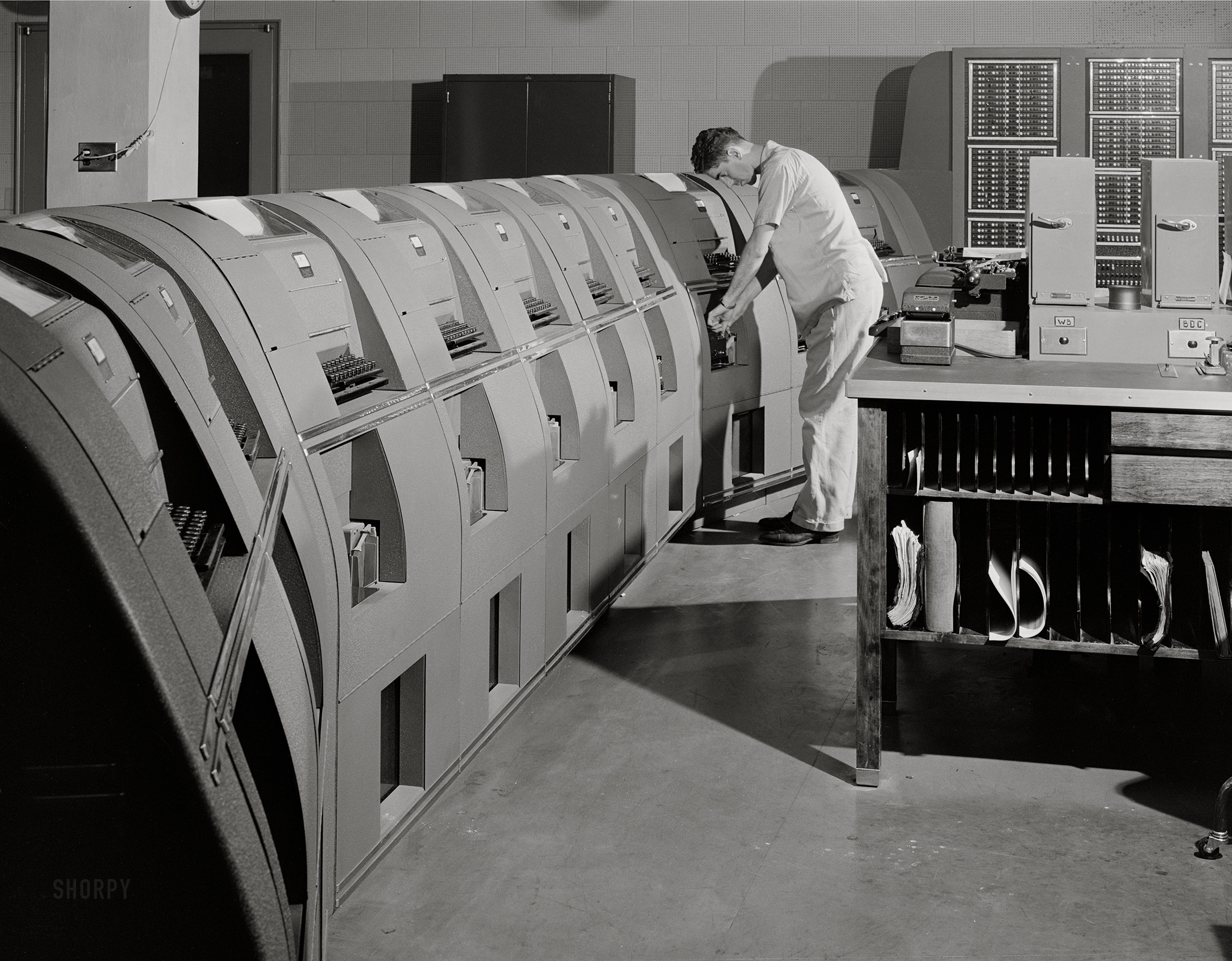 July 1941. "Municipal airport, Washington, D.C. -- In the teletype room, where weather data and other information is constantly being received." Photo by Jack Delano. View full size.
