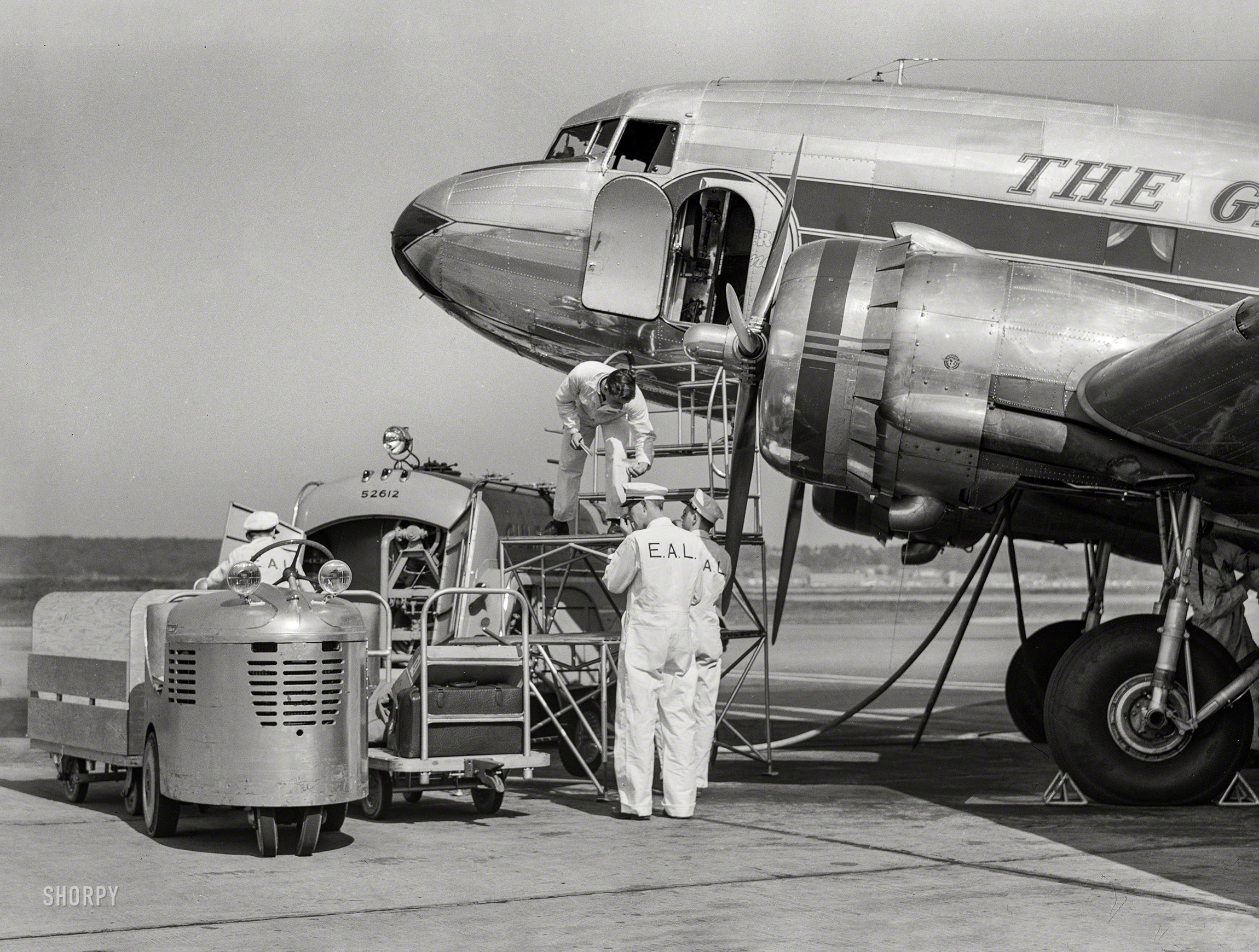 July 1941. "An airliner taking on baggage and fuel. Washington, D.C., municipal (National) airport." Medium format negative by Jack Delano. View full size.