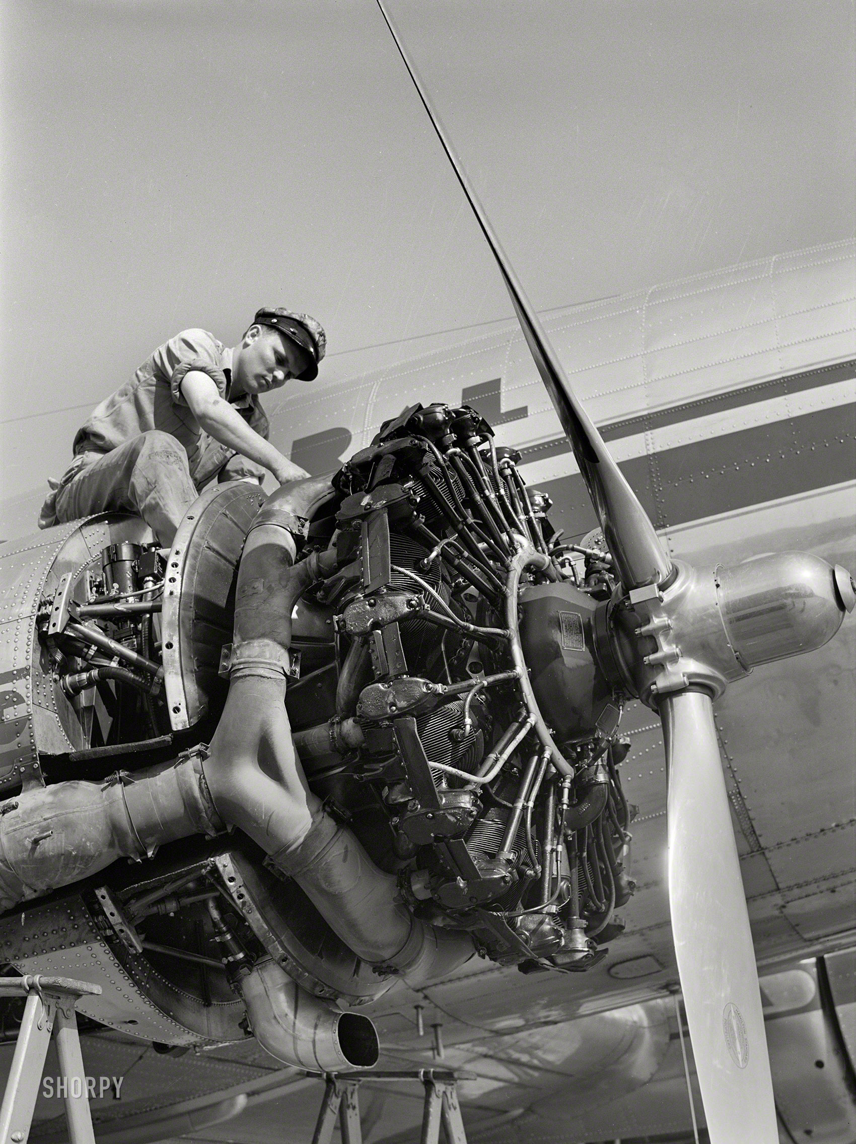 July 1941. "Working on an engine of one of the airliners. Municipal airport, Washington, D.C." Acetate negative by Jack Delano. View full size.