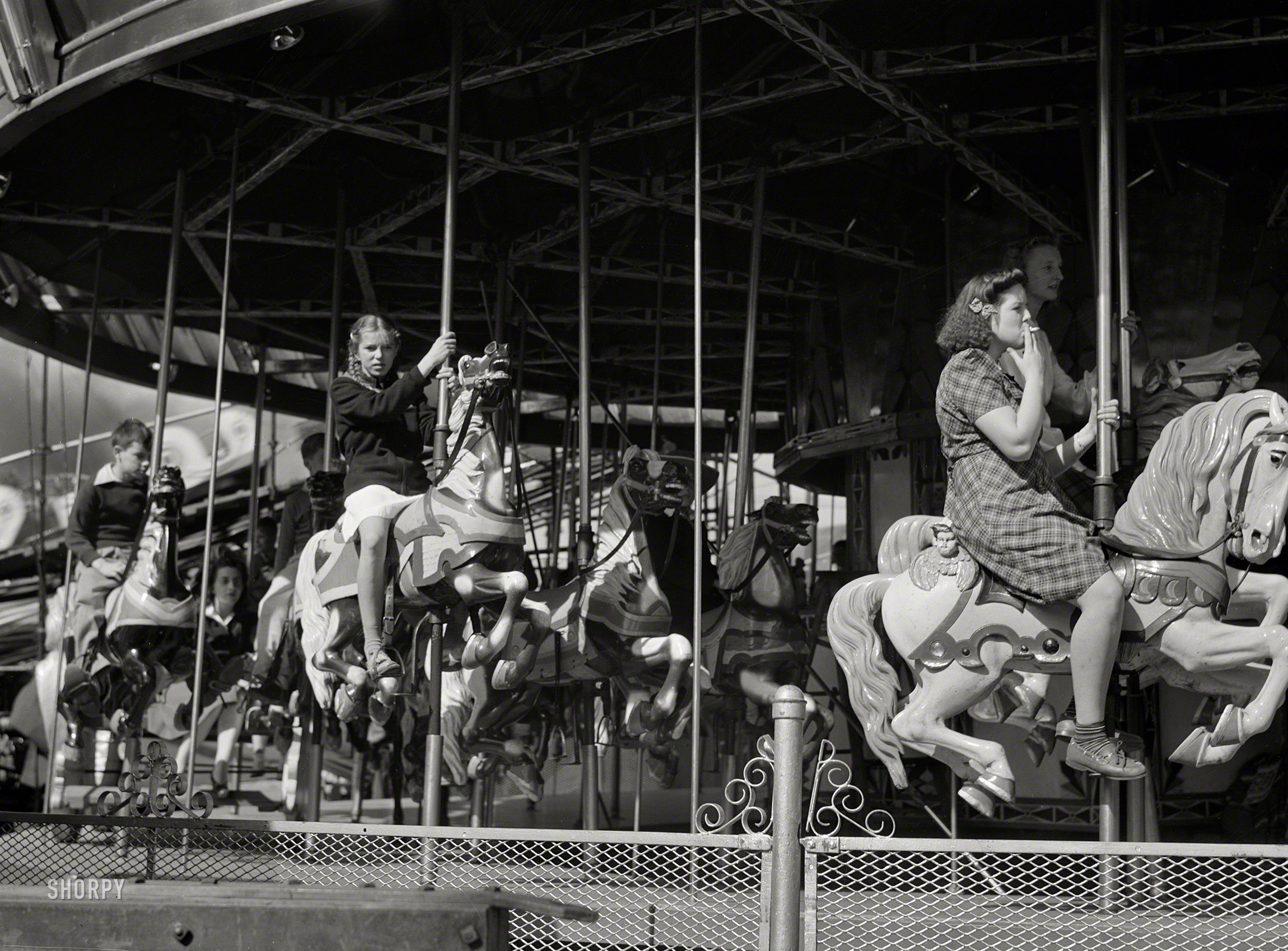 September 1941. "The merry-go-round at the State Fair in Rutland, Vermont." Medium format acetate negative by Jack Delano. View full size.