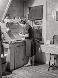 September 1941. "Mrs. W. Gaynor canning tomatoes on their farm near Fairfield, Vermont." Medium format negative by Jack Delano. View full size.
