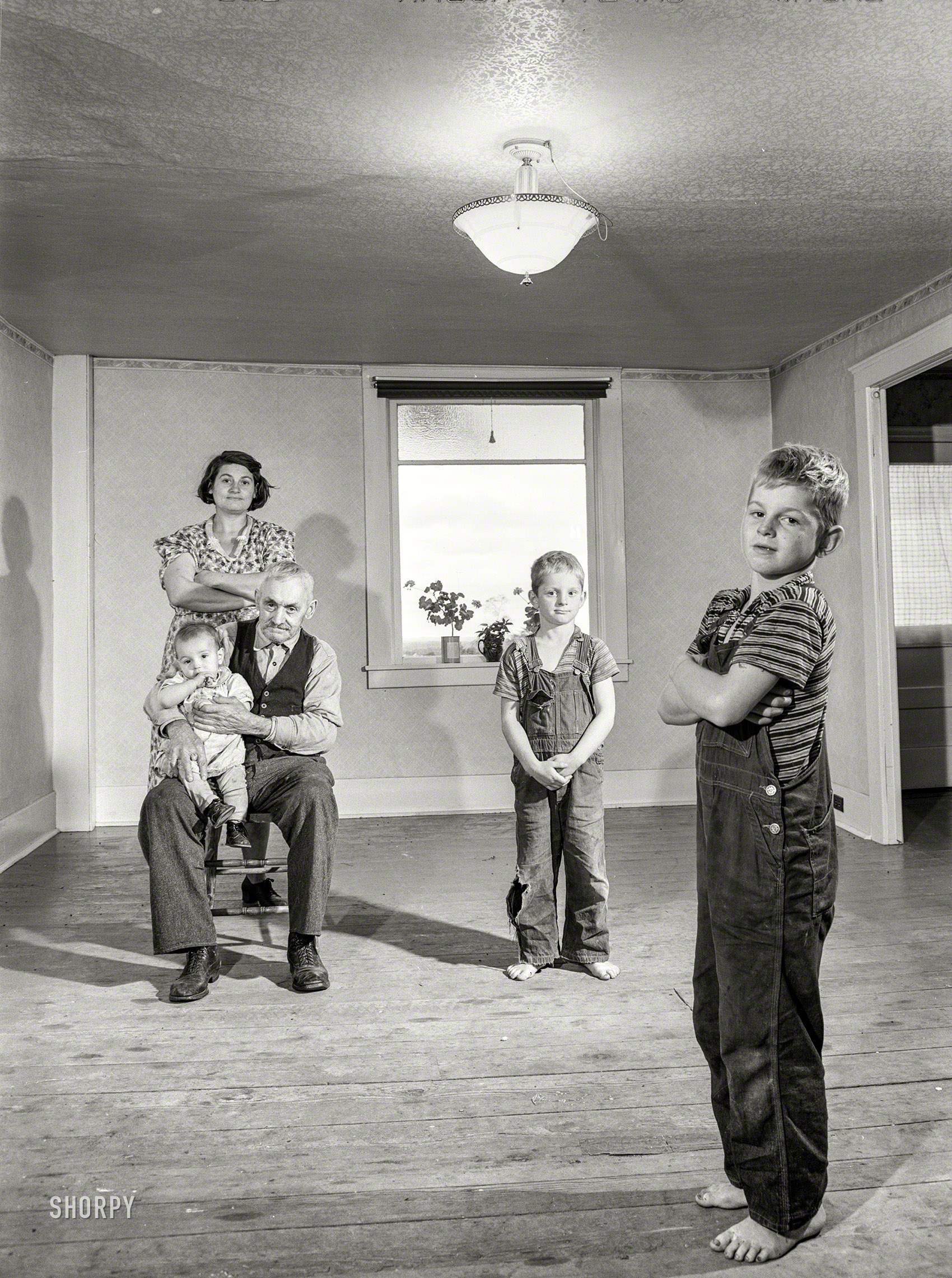 October 1941. "Mrs. Melvin Rivers, some of her children and her father-in-law in their new relocation corporation farm to which they have moved just recently, near Orwell, New York." Medium format negative by Jack Delano. View full size.