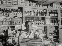 December 1941. "Bayamon, Puerto Rico (vicinity). Proprietor of a small general store, which will soon be evacuated because it is in an area to be taken over by the Army." Medium format negative by Jack Delano. View full size.