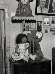 December 1941. "Charlotte Amalie, Saint Thomas Island, Virgin Islands. A colored doll in one of the houses in a slum area." Photo by Jack Delano. View full size.