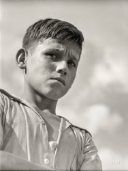 January 1942. "San Sebastian, Puerto Rico. Boy who was playing in the street." Medium format negative by Jack Delano. View full size.