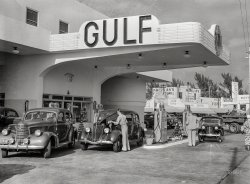 April 1939. "Miami Beach, Florida. Even the gas stations are on an elaborate scale, often modern in design, resembling hotels." Medium format negative by Marion Post Wolcott for the Farm Security Administration. View full size.