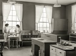 May 1939. "Dorothy Smith and Elizabeth Atkinson setting table in home economics room in school building. Ashwood Plantations, South Carolina." Medium format negative by Marion Post Wolcott. View full size.